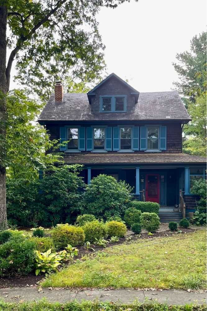 Brown Catonsville house with blue trim